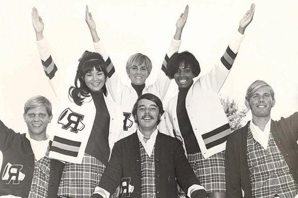 A cheer team with hands outstretched